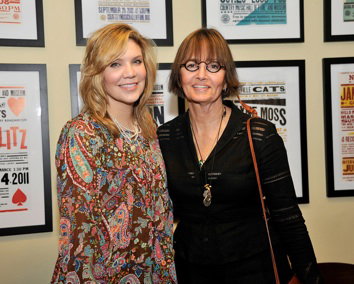 Two women posing backstage at the tribute program